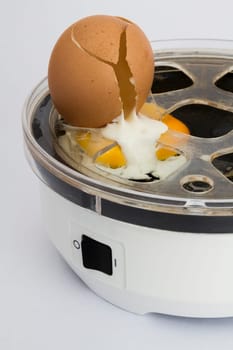 broken eye in electric boiler in neutral grey background