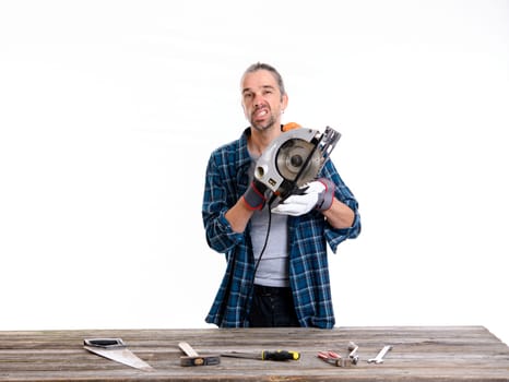 funny worker in blue plaid shirt working with wood