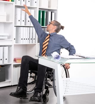 disabled business man in wheelchair working in the office and has problems