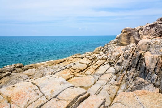 Beautiful natural landscape of rock along the coastline with blue sea under the summer sky at Koh Samui island, Surat Thani province, Thailand