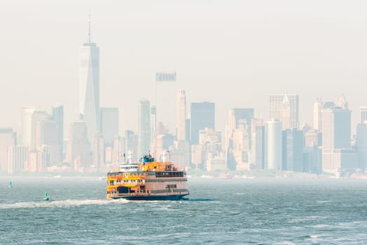 Staten Island Ferry and Lower Manhattan Skyline, New York City, USA.
