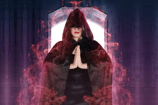 Attractive witch woman showing her magic power with wall background