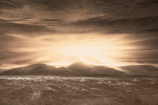 Dry land with dark cloud on the sky. Halloween background