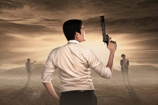Rear view of man with guns ready to fight against zombies. Halloween concept