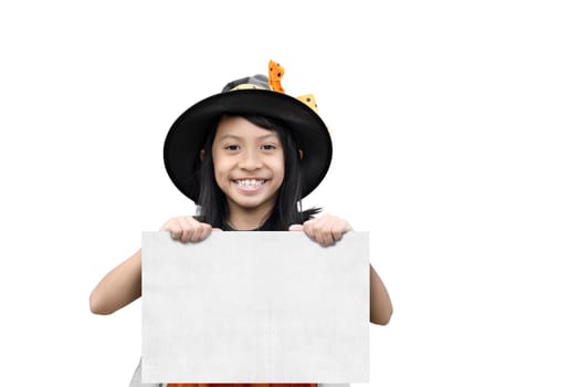 Happy asian witch girl holding white paper for copy space isolated over white background