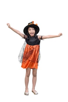 Portrait of asian girl in witch costume and hat standing isolated over white background
