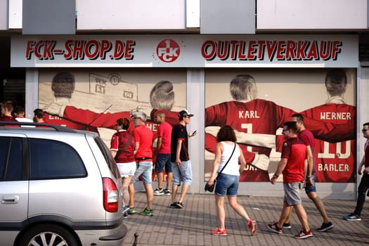 Kaiserslautern, Germany - August 07, 2018: Fans of the 1. FC Kaiserslautern football club in front of a fan shop on August 07, 2018 in Kaiserslautern.