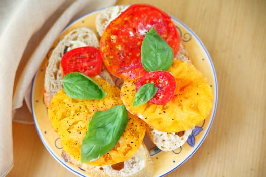 Overhead of heirloom tomato sandwich with napkin and room for text