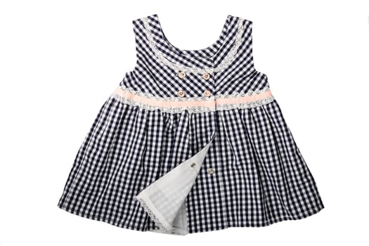 Clothes for children. A black and white checkered dress with pink loop isolated on white background. Children fashion.