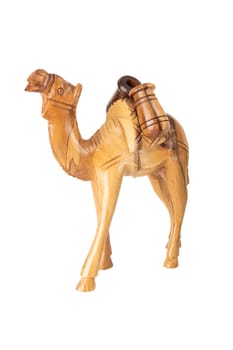 Wooden carved camel isolated on white background. Place for your food and display product montage.