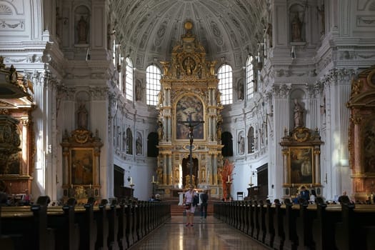 Munich, Germany - June 30, 2018: The altar and the gold-decorated and sacral decorated interior of St. Michael's Church on June 30, 2018 in Munich.