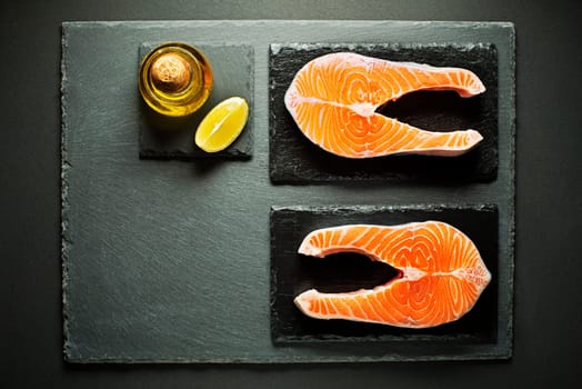 Slices of red salmon fish with spices. Prepare for cooking meal.