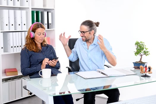 businesswoman in wheelchair and her colleague having anger in the office