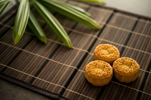 Traditional baked mooncakes is offered to friends or family during Mid-Autumn Festival. The Chinese character represent "lotus paste"" in English."