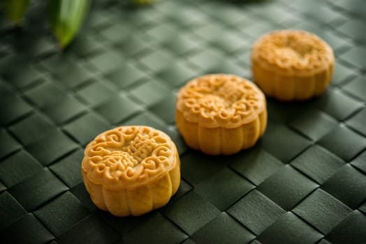 Traditional moon cakes is offered to friends or family during Mid-Autumn Festival. The Chinese character represent "lotus paste"" in English."