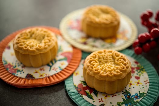 Mooncakes is offered to friends or family during Mid-Autumn Festival. The Chinese character represent "lotus paste"" in English."