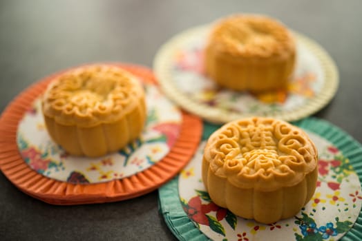 Mooncakes is offered to friends or family during Mid-Autumn Festival. The Chinese character represent "lotus paste"" in English."