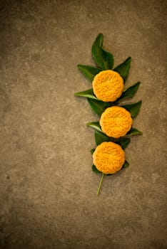 Mooncakes is traditional pastry eaten during the Mid-Autumn Festival. Flatlay on table top low light with copy space. The Chinese character represent "lotus paste""."