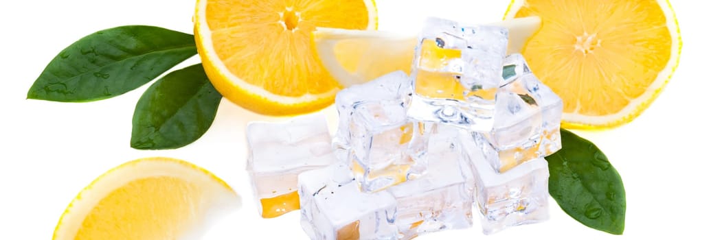 Cubes of cold ice, and halves of fresh, bright juicy lemon on a white background.