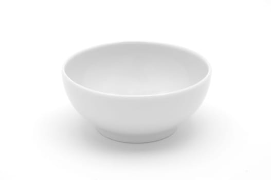 Empty white ceramic cup on white background isolated.