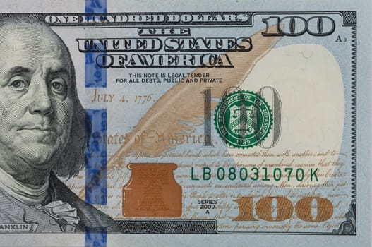 Part of the bill is one hundred US dollars. Right part.
