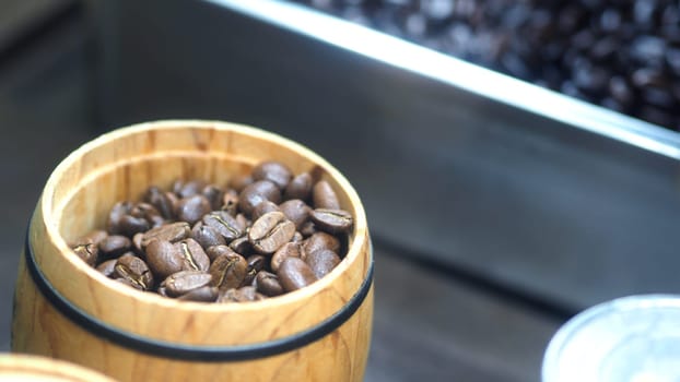 Many coffee beans from excellent source around the World in silver metal tray which special hand made roasted for barista bring a good aroma taste of freshness to their customer.