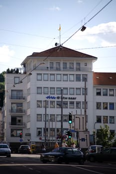 Saarbruecken, Germany - July 29, 2018: The building of the HTW Saar, the University of Applied Sciences Saarland behind a traffic light junction on July 29, 2018 in Saarbruecken.