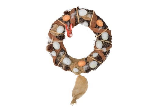 Easter willow wreath with eggs and wooden easter bunny isolated on white background. Happy easter.