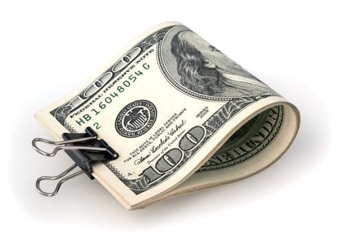 Banknotes for one hundred dollars are folded and stapled. White background.