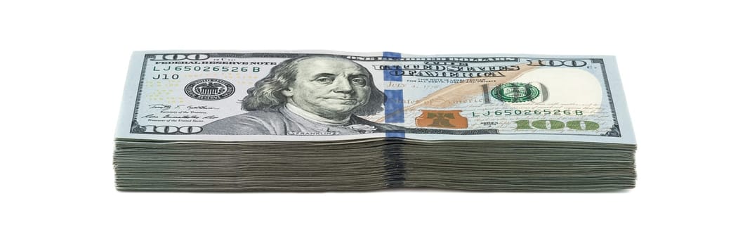 Ten thousand dollars in a pack of one hundred dollars. View at an angle. Isolated.