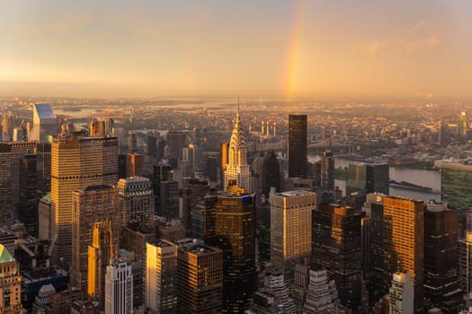 Skyscrapers at midtown New York City with the East River on the background at dramatic after the storm sunset light, USA.