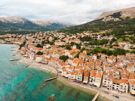 Aerial panoramic view of Baska town, popular touristic destination on island Krk, Croatia, Europe.
