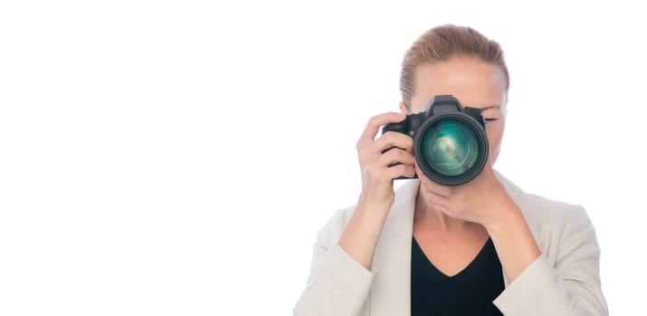 Female photographer taking images with dslr camera isolated on white background.