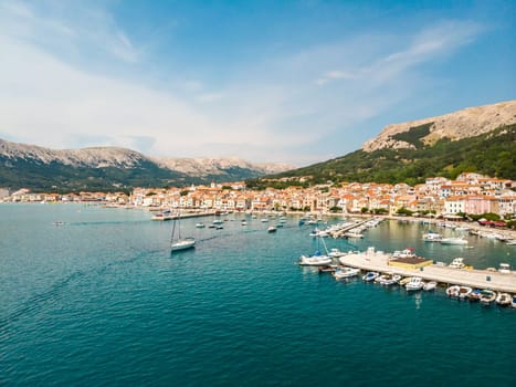 Aerial panoramic view of Baska town marina, popular touristic destination on island Krk, Croatia, Europe.