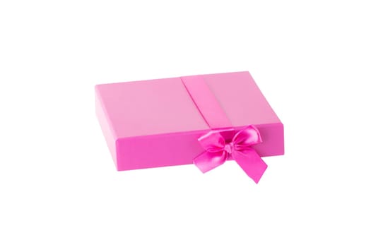 Pink gift box with pink ribbon bow isolated on a white background.