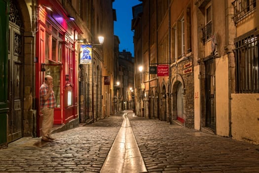 LYON, FRANCE - August 21, 2018: Colorful saint Jean district in old Lyon, the famous and typical old town of the city of Lyon by night. Duboeuf famous old street of Lyon.