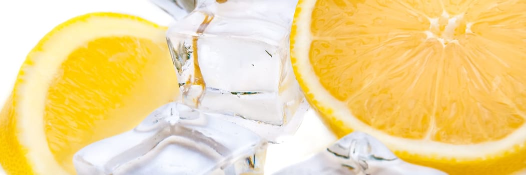 Half a juicy bright lemon and refreshing ice cubes