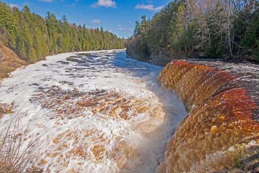 Rushing Waters over a Flooded Upper Tahquamenon Falls in Tahquamenon Falls State Park in Upper Michigan