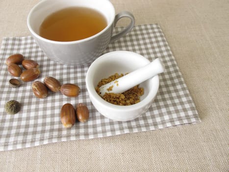 Acorn coffee from roasted acorns crushed in a mortar