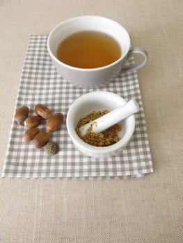 Acorn coffee from roasted acorns crushed in a mortar