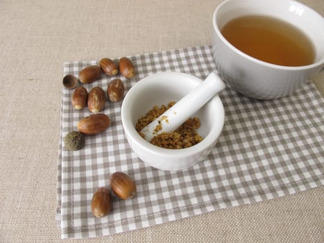 Acorn coffee from roasted acorns crushed in a mortar