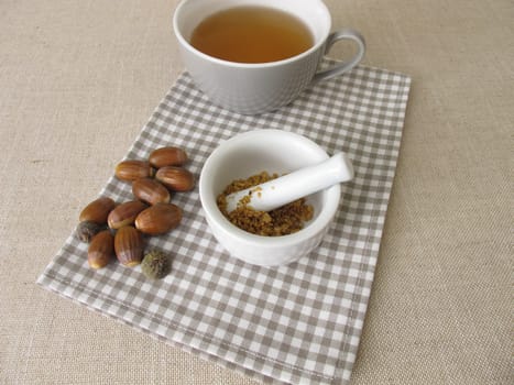 Acorn coffee from roasted acorns crushed in a mortar