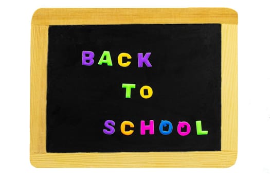 Back to school text written with colorful letters on blackboard. School board isolated on white background. Concept education.