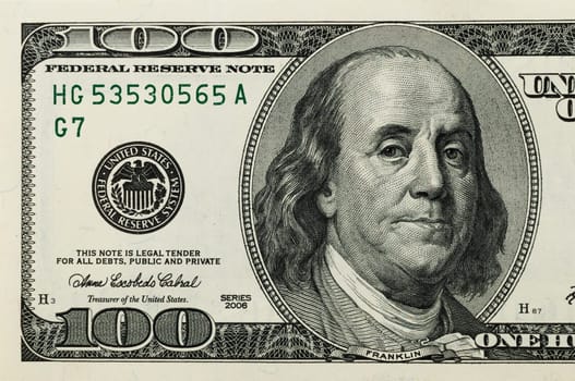 Part of the bill is one hundred US dollars. The left part.