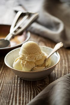 Homemade Organic Vanilla Ice Cream scoops on wooden table
