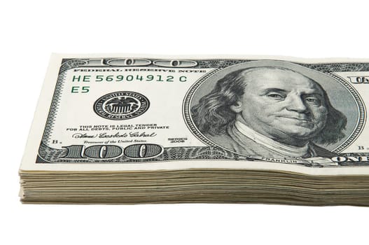 Part of a pack of one hundred dollar bills. View at an angle. Close-up.