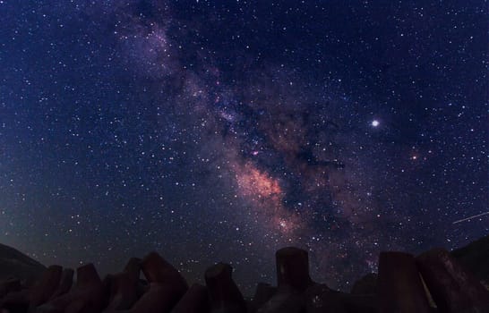 Night landscape with colorful Milky Way. Starry sky  at summer. Beautiful Universe. Space background