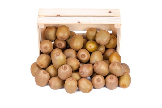 Wooden box with ripe kiwi fruits in front of it isolated on white background