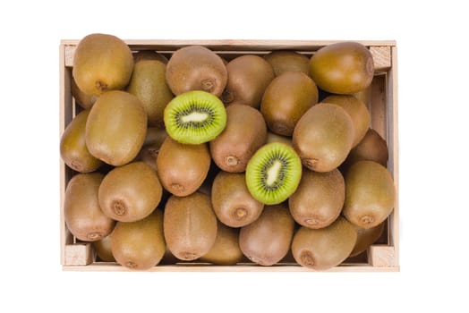 Wooden Box filled with many ripe Kiwi fruits and two half fruits isolated in white background view from top