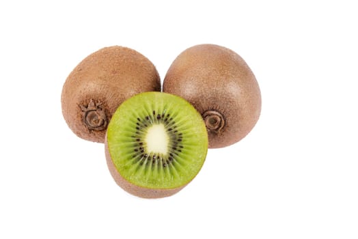 Two whole and one half ripe and fresh Kiwi fruit isolated on white background